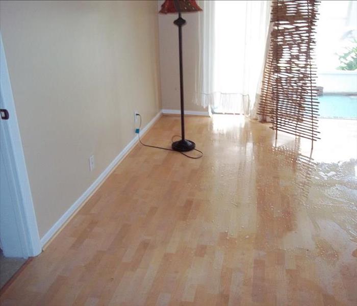 A room with light colored hardwood floors.