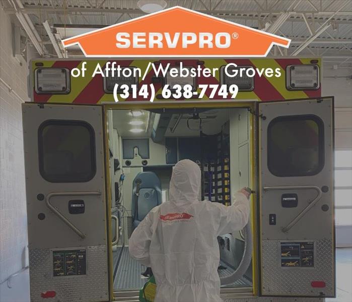 person standing in front of a fire truck.