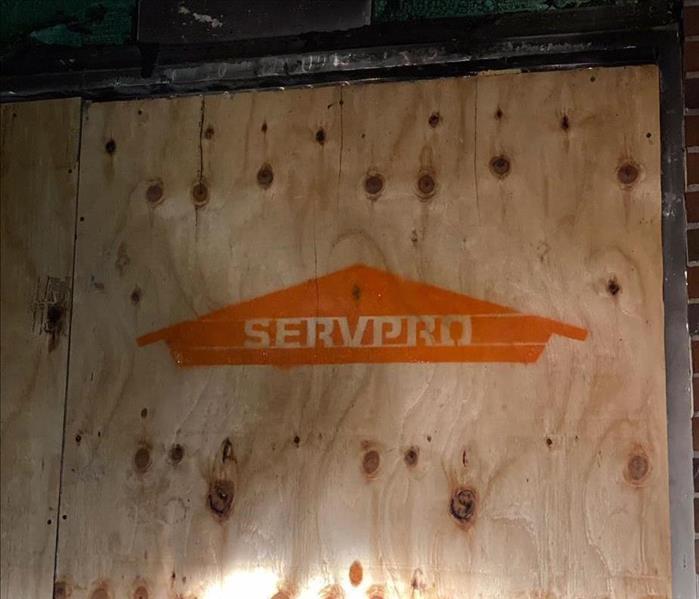 Wood panel with SERVPRO logo.