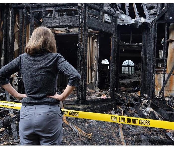 A woman is upset about her building which has burned down