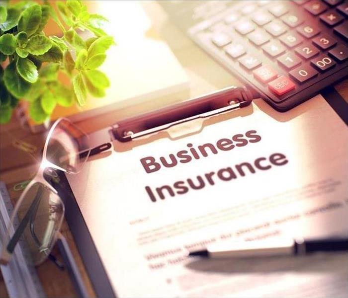 Business Insurance form in a clipboard