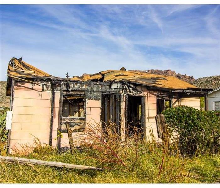 Home Destroyed By Fire With Caved In Roof